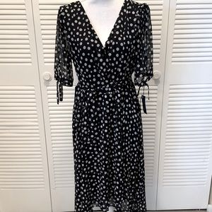 Tommy Hilfiger chic faux wrap dress with polka dots in airy chiffon fabric.